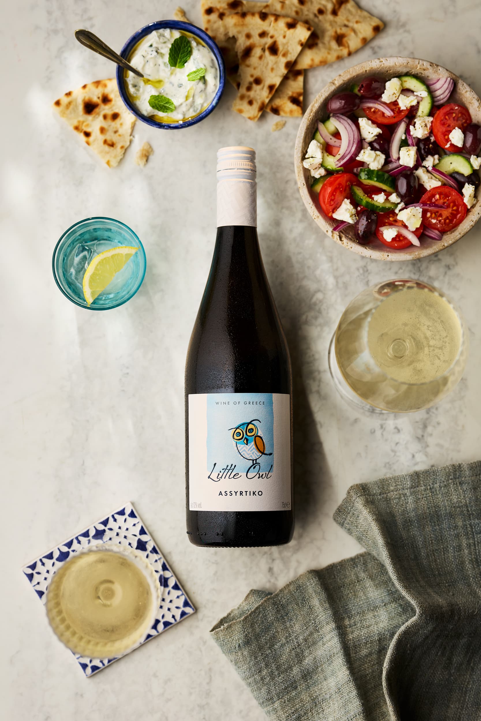 Assyrtiko overhead with herbs and olives