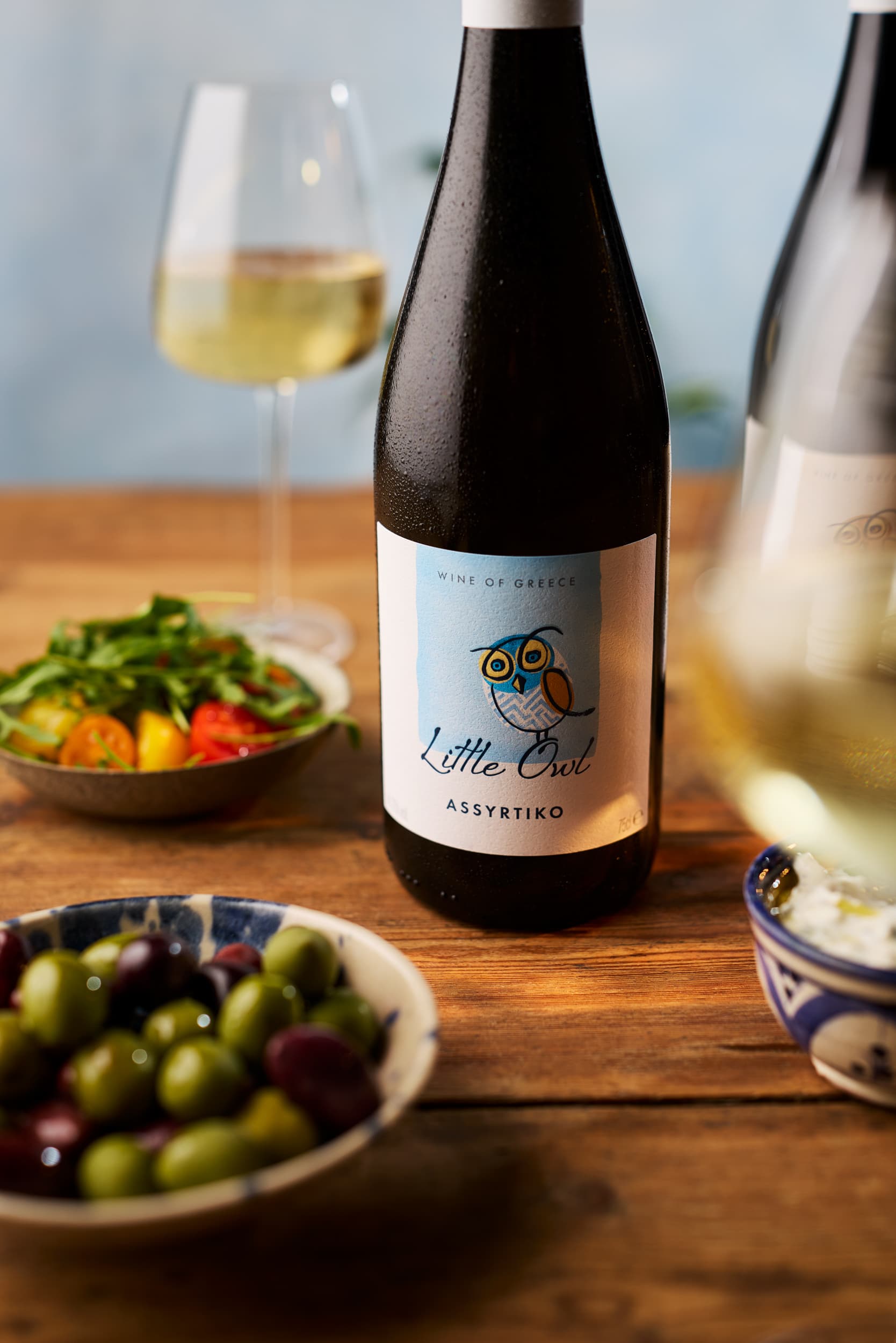 Little Owl Assyrtiko wine with Mediterranean salad and olives